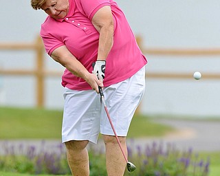 Jeff Lange | The Vindicator  Lori Bowden of Canfield makes her tee shot to the 9th hole at the Lake Club during the Greatest Golfer tournament held on Sunday. Bowden went on to take first place in her division.