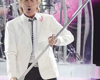 Rod Stewart performs his opening number, “Infatuation” at the Covelli Centre on Sunday night. The British rocker, 69, attracted a packed house of fans.