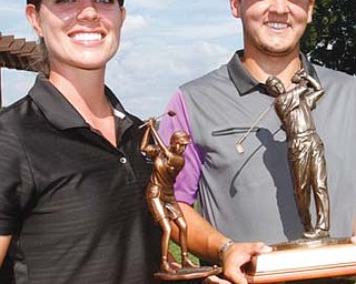 Katie Rogner displays her trophy as winner in the women’s division of the 2014 Greatest Golfer of The Valley tournament Sunday. Matt Gurska, right, won the Pete Mollica Men’s Open.