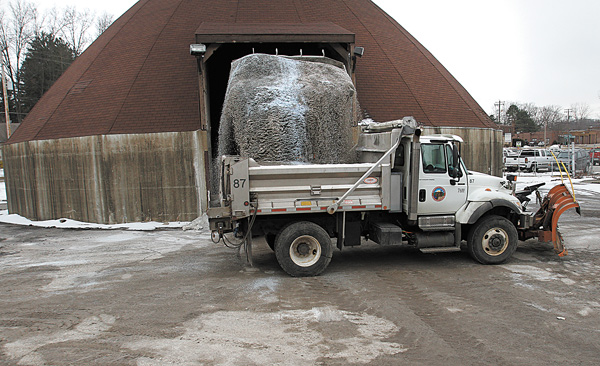 A Mahoning County Engineer’s office truck is loaded with salt before a February snowstorm. Local communities are working with the Ohio Department of Transportation and Morton Salt to lower prices for the coming winter.