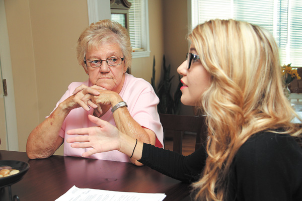 Geneva Peck, left, of Austintown, listens to her granddaughter, Sammantha Bonacci, talk about what it was like watching Peck go through cancer treatments.