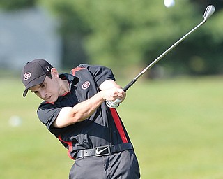 Girard’s Mark Standohar approaches the 16th green of Mahoning Country Club in Girard from the fairway with an
iron during Wednesday’s match against Brookfield. Girard won 172-206 to maintain a 7-0 record.