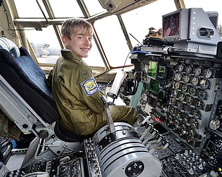 Christian Abrigg, 13, of Canfield smiles as he sits in the pilot's seat of a U.S. Air Force C-130 airplane, Wednesday during his experience of the Pilot for a Day program at the 910th Air Wing in Vienna.