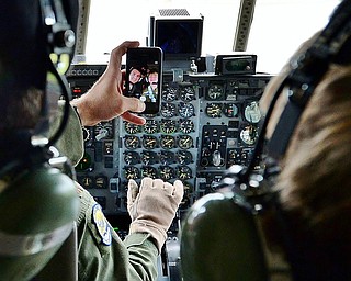 1st Lt. Zachary Eberle (left) takes a picture with 13-year-old Christian Abrigg of Canfield in the cockpit of a C-130, Wednesday afternoon at the 910th Air Wing in Vienna.