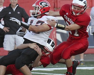 William D Lewis The Vindicator  Girard'sJacob Ryser(12)) is stopped by Niles.Zack Atkins (41) and (27)