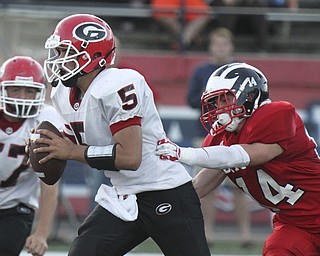 William D  Lewis The Vindicator  GIRARD QB Christian Bello is prsued by Niles Ricky Palmer(14).