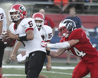 William D  Lewis The Vindicator  GIRARD QB Christian Bello is prsued by Niles Ricky Palmer(14).
