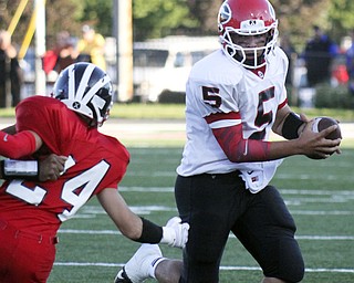 William D Lewis The Vindicator  Girard's Christian Bello(5) eludes Niles'(24) during 1rst qtr action 8-28 at Niles.