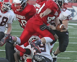 William d Lewis the vindicator NilesQB(40) is tripped up during 8-28 game with Girard.