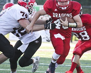 William d Lewis the Vindicator Niles QB(40) is stopped by Girard's Jason Sims(76) during 8-28 action at Niles.