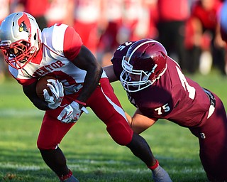 BOARDMAN, OHIO - AUGUST 29, 2014: Receiver Jerrell Jackson #3 of Mentor is tackled by defensive linemen Doug Kephart after a small gain during the 1st quarter of Friday nights OHSAA football game at Boardman Spartans Stadium. (Photo by David Dermer/Youngstown Vindicator)