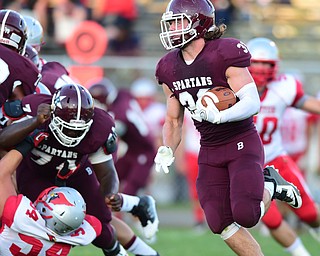 BOARDMAN, OHIO - AUGUST 29, 2014: Running back Evan Croutch #33 of Boardman runs the ball around the corner on a jet sweet for a big gain during the 1st quarter of Friday nights OHSAA football game at Boardman Spartans Stadium. (Photo by David Dermer/Youngstown Vindicator)