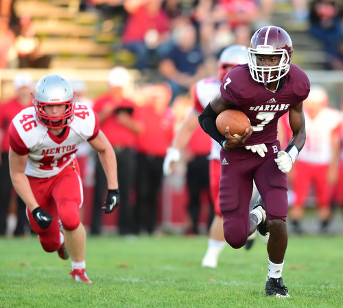 BOARDMAN, OHIO - AUGUST 29, 2014: Quarterback Marcus Smith #7 of Boardman runs in the open field after breaking into the secondary during the 1st quarter of Friday nights OHSAA football game at Boardman Spartans Stadium. (Photo by David Dermer/Youngstown Vindicator) Linebacker Bradie Crandell #46 pictured.