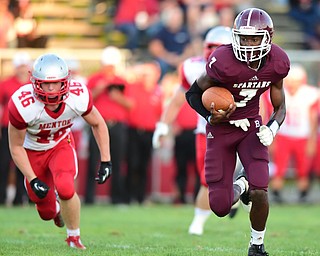 BOARDMAN, OHIO - AUGUST 29, 2014: Quarterback Marcus Smith #7 of Boardman runs in the open field after breaking into the secondary during the 1st quarter of Friday nights OHSAA football game at Boardman Spartans Stadium. (Photo by David Dermer/Youngstown Vindicator) Linebacker Bradie Crandell #46 pictured.