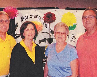 SPECIAL TO THE VINDICATOR: Those helping to organize the Mahoning Valley Dahlia Society Midwest Dahlia Conference Show are, from left, Dave Habeger, treasurer; Joyce Habeger, secretary; Harriet Chandler, show chair; and Randy Foith, president of the MVDS and Midwest Dahlia Conference.