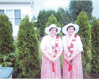 The theme of the 39th Twins Days Festival, in Twinsburg, Ohio, was a trip to the 1960s, ’70s and ’80s. The festivities began with a Family Twins Picnic, over which the 2013 Royal Court presided. At left, twins Rose Italiano Pacalo, left, and Charlotte Italiano completed their 2013 reign as queens when they installed members of the 2014 court. As 10-year event participants in the world’s largest gathering of multiples, Rose resides in North Lima and Charlotte lives in Poland. They were awarded a 2014 bronze medal in their twins category.
SPECIAL TO THE VINDICATOR