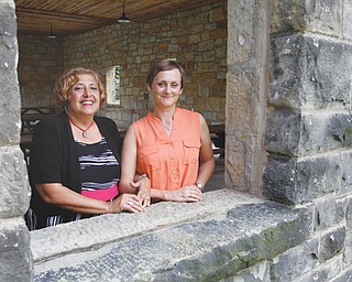 Donna Detwiler, left, and Anna Aey are both cancer survivors who met in 2010 at the Athena Awards banquet. Shortly thereafter, they founded Yellow Brick Place, a nonprofit organization where cancer survivors and their loved ones have access to a variety of support services.