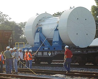 In this undated photo released by the Idaho National Laboratory, rail cars carry spent nuclear fuel headed to a federal laboratory in Idaho. The U.S. Department of Energy recently asked for suggestions on getting rail cars to haul used, radioactive fuel from civilian nuclear-power reactors to a final depository. However, the U.S. government hasn’t decided where that used fuel ultimately will go.