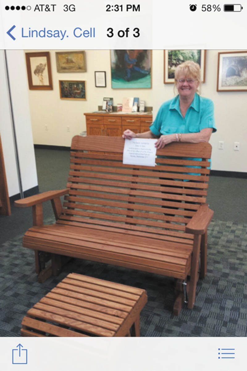 SPECIAL TO THE VINDICATOR: This wooden glider and footrest will be raffled off at the Leetonia Artisans Festival on Sept. 21 in Wick Park. The furniture is on display at the Leetonia Library, 181 Walnut St.