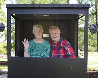 Patsy Anne and Don Zabel sit in the historical Amish buggy they donated to the historic village at Boardman Park. They donated the buggy along with a steppingstone that has been in Patsy Anne’s family for more than 80 years.