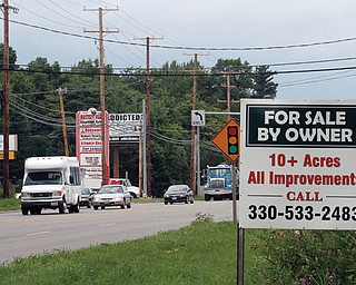 Properties along state Route 46 are for sale in the area surrounding Hollywood Gaming at Mahoning Valley Race Course. The casino section opens Sept. 17, and the winter racing season begins Nov. 24.