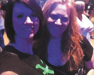 Michelle Adams of Youngstown, left, met her friend Karen Toothman of Boardman, through Steelhounds Hockey. They were at the Buckcherry Show in Pittsburgh at Stage AE for this photo in May 2013.