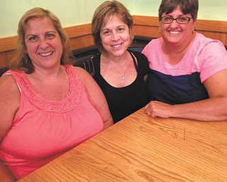 From left are Beth Groves of Indianapolis, Lori Farkas of Columbiana, and Charlene Hughes of North Jackson, who have been friends since kindergarten (47 years). They met for dinner this summer and all those years melted away!