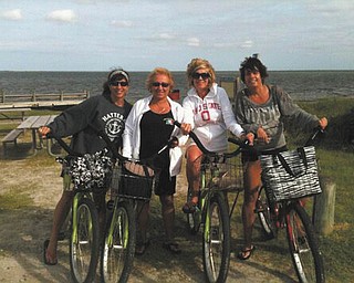 Girlfriends on Ocracroke Island, NC, from left, are Nancy Grapevine and Patty Meehan, both of Lowellville, Debbie Schultz of Poland and Gina Vicarel of Lowellville. Sent by Schultz.