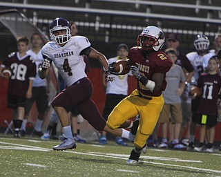 Cardinal Mooney running back C.J. Amill (2) runs in open field past Boardman's Jon Cina (4) during the first quarter of Friday nights matchup at Stambaugh Stadium on the campus of Youngstown State University.  Dustin Livesay  |  The Vindicator  09/05/14  YSU.