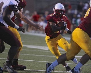 Cardinal Mooney running back C.J. Amill (2) finds a hole in the Boardman defense during the first quarter of Friday nights matchup at Stambaugh Stadium on the campus of Youngstown State University.  Dustin Livesay  |  The Vindicator  09/05/14  YSU.