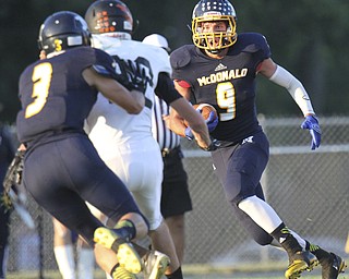 William D.Lewis The Vindicator McDonald's JAke Reckerd(9) scampers for1 rst qtr yardage Friday 9-5-14 against Springfield.