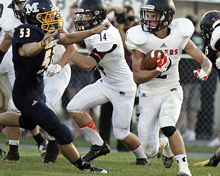 William d Lewis the vindicator Springfield's Frankie Centofani(2) tries to ghet past McDonald's Dale Wolford(53) during 1rst half action Friday 9-5-14 at McDonald.