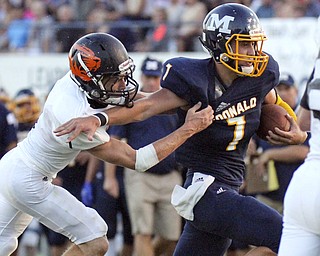 William D. Lewis The vindicator  McDonald's Ben Carkido(7) eludes Springfield's Ian Grdina(1) during 1rst half action at McDonald 9-5-14.