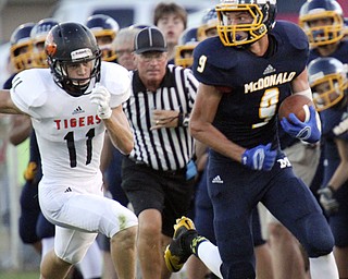 William D.Lewis The Vindicator McDonald's Jake Reckerd(9) eludes Springfield's Ryan Kohler(11) while scampering for 1 rst half yardage at McDonald 9-5-14.