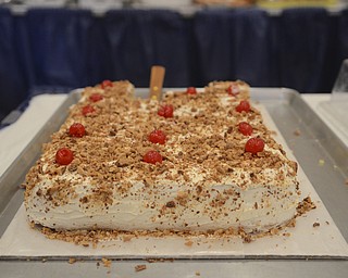Katie Rickman | The Vindicator.A "pasta" cake of torte cake which is a sponge cake with custard filling and covered with toasted almonds and cherries is one of the many sweet treats to buy at the Greek Festival at Archangel Michael Greek Orthodox Church September 6, 2014.