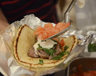 Katie Rickman | The Vindicator.A original Greek style Gyro is prepared at the Greek Festival at Archangel Michael Greek Orthodox Church in Campbell September 6, 2014.