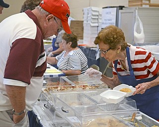 Katie Rickman | The Vindicator.Hank Glogowski of New Bedford orders Baklava and Christine Stevens chooses the best one to pick September 6, 2014.