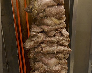 Katie Rickman | The Vindicator.Pork is piled onto a spit at the Greek Festival at Archangel Michael Greek Orthodox Church in Campbell.  This style, according to Bill Likouris, is the tradition way to prepare the meet for a Greek gyro.