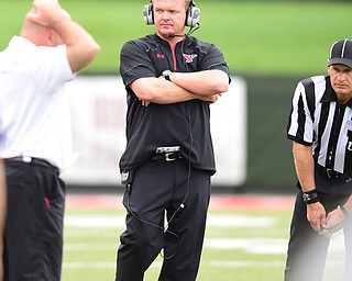 YOUNGSTOWN, OHIO - SEPTEMBER 6, 2014: Head coach Eric Wolford of YSU stands on the sideline at the end of the 3rd quarter during Saturday afternoon game at Stambaugh Stadium. YSU won 34-23. (Photo by David Dermer/Youngstown Vindicator)
