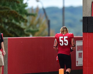YOUNGSTOWN, OHIO - SEPTEMBER 6, 2014: Offensive linemen Trevor Strickland #55 of YSU walks to the locker room after being ejected from the game for throwing a punch during the 4th quarter of Saturday afternoon game at Stambaugh Stadium. YSU won 34-23. (Photo by David Dermer/Youngstown Vindicator)