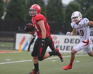 Youngstown State's Nate Adams (44) outruns Duquesne's Rich Piekarski (13) on his way to the end zone during the second quarter of Saturday evenings matchup at Stambaugh Stadium.  Dustin Livesay  |  The Vindicator  9/6/14  Stambaugh Stadium