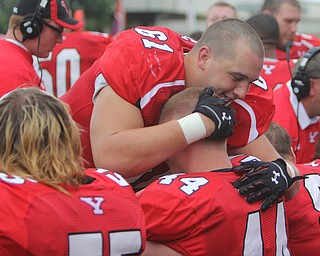Youngstown State's Justin Spencer (61) hugs Nate Adams (44) after Adams completed a touchdown reception during the second quarter of Saturday evenings matchup at Stambaugh Stadium.  Dustin Livesay  |  The Vindicator  9/6/14  Stambaugh Stadium