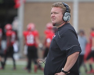 Youngstown State head coach Eric Wolford looks at the scoreboard after Duquesne narrowed the YSU lead by seven during the second half of  Saturday evenings matchup at Stambaugh Stadium.  Dustin Livesay  |  The Vindicator  9/6/14  Stambaugh Stadium