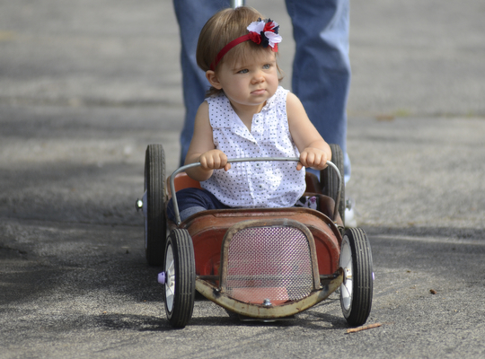 Katie Rickman | The Vindicator.Emma Benton, 16 months, of Cortland rode around the Rust Belt car show in a sportster wagon that her father Allan created for her September 7, 2014.