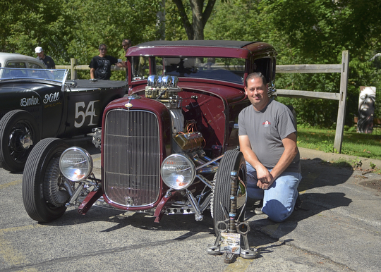 Katie Rickman | The Vindicator.Tony Lombardi poses next to his 1930 Model A that won best of show at the second annual Rust Belt car show and artist market at the B&O station September 7, 2014.