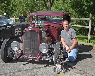 Tony Lombardi of Warren poses with his 1930 Model A that won the best-in-show award at Sunday’s second annual Artists of the Rust Belt car show and artists’ market at the B&O banquet hall, 530 Mahoning Ave., Youngstown.