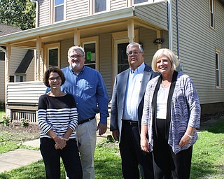  From left Jan Casey and her husband Bill Casey, Kurt Sauer and his  .wife Diane Sauer, stand in front of a renovated home at 453 Vine  .Street Northeast that is available for sale thanks to a $25,000  .donation from the Caseys. The home is in the Garden District just  .north of downtown. Bill Casey and Diane Sauer are members of Trumbull  .100, which announced Monday that the philanthropic organization will  .donate $10,000 toward future renovation projects in the Garden  .District, and the Sauers have donated $5,000 that also will be  .matched by Trumbull 100.