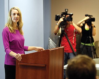 Pam Lilak, executive director of the Downtown Wellness Community, explains to reporters that DWC is a movement to improve the health of people who work and live in downtown Youngstown and the city’s surrounding areas.