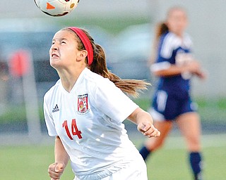 Canfield sophomore Alana Petracci heads the ball toward the goal in Monday’s 5-0 victory over Austintown Fitch in Canfield.