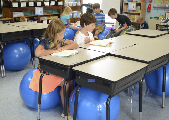 Katie Rickman | The Vindicator.Alena Len, 8, of North Jackson and Benjamin Moore, 8, also of North Jackson read in Mrs. Cara Vernal's third grade classroom at Jackson-Milton Elementary School Tuesday, September 9, 2014 in North Jackson, Ohio.